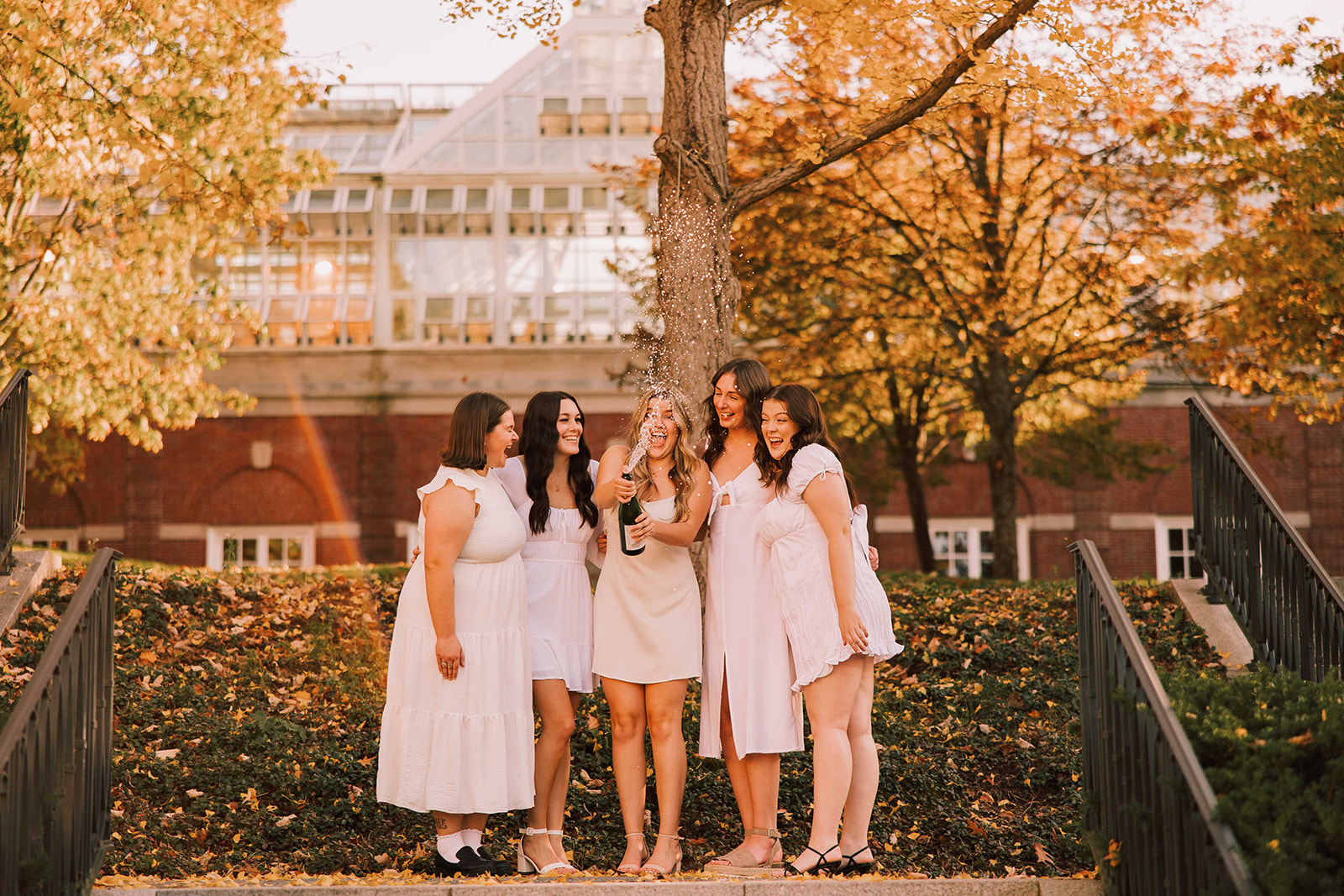 Acadia Graduation Photos Popping Champagne